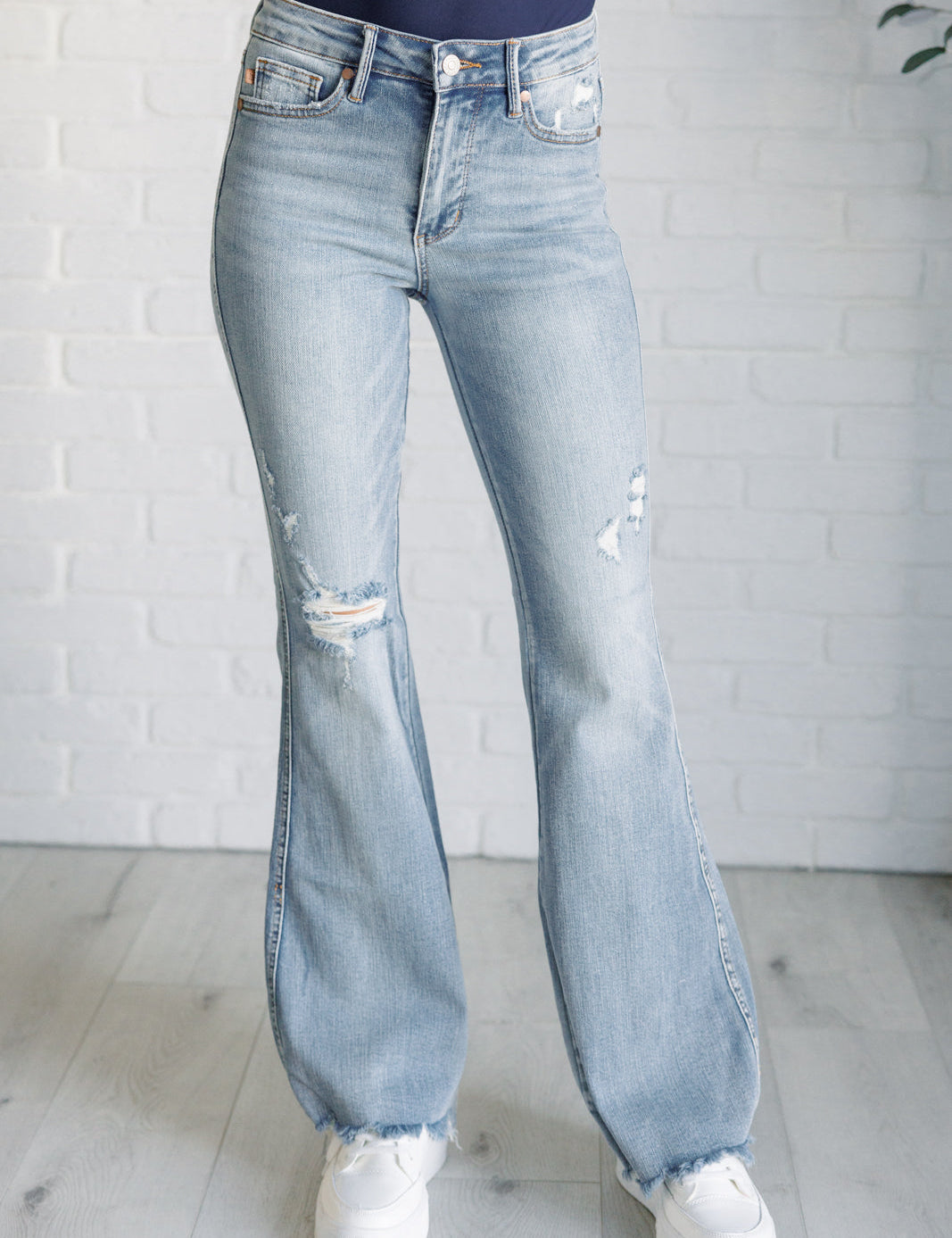 CarolineMidRiseControlTopDistressedFlareJeans1_99e4141b-f3d1-4bb4-ae78-787f79966037.jpg