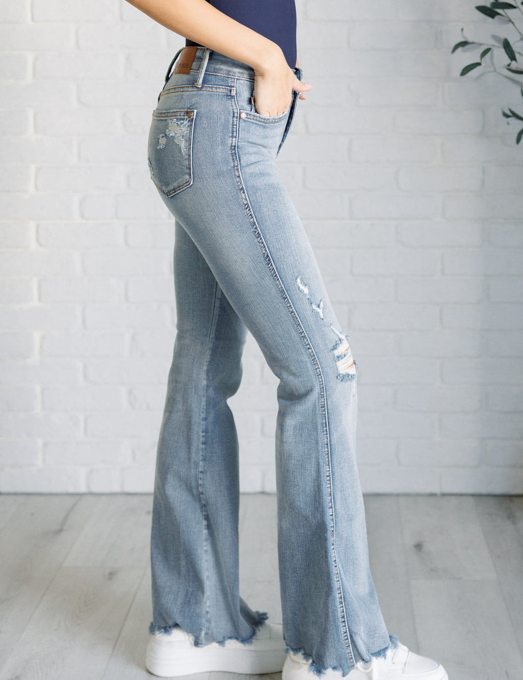 CarolineMidRiseControlTopDistressedFlareJeans4_294ee917-aaaf-45db-b7dd-aba8ff3edde8.jpg