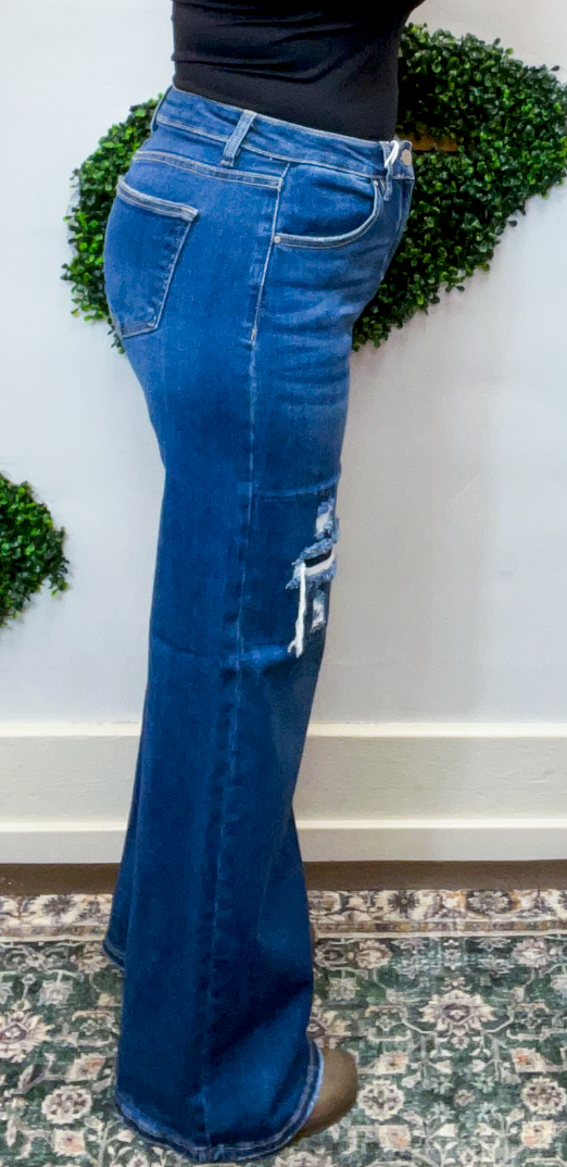 Risen | High Rise Wide Leg Jeans with Distressing & Hidden Patch Detail in Dark Wash